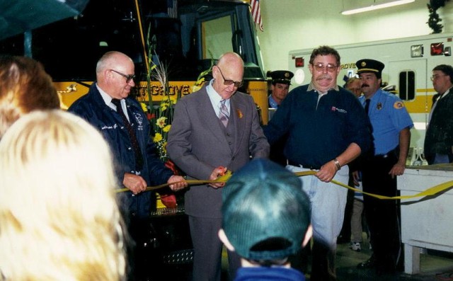 Life Member George LeFevre cuts the ribbon at the 1998 Housing